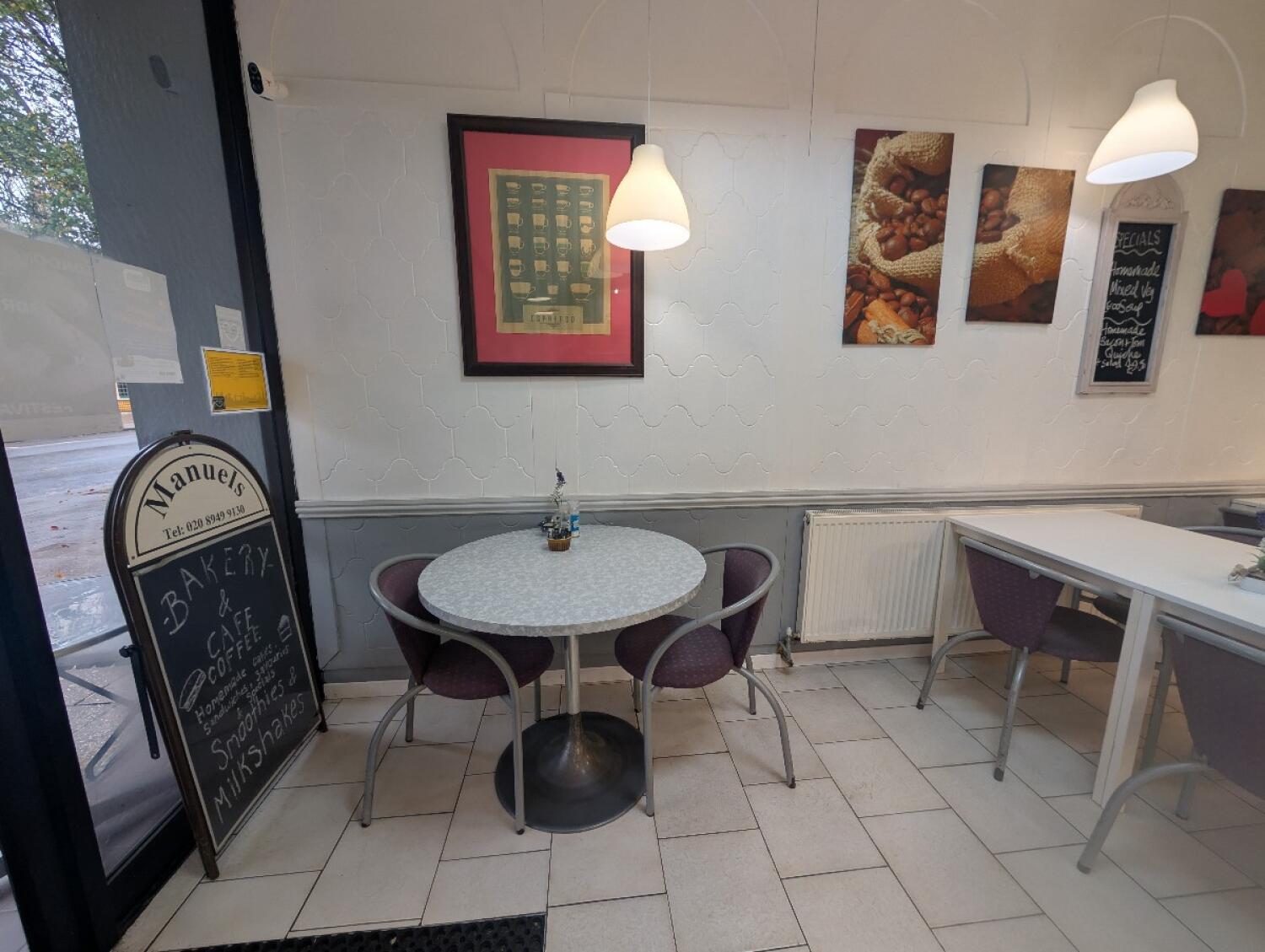 From entrance facing left. Table and chairs in front.