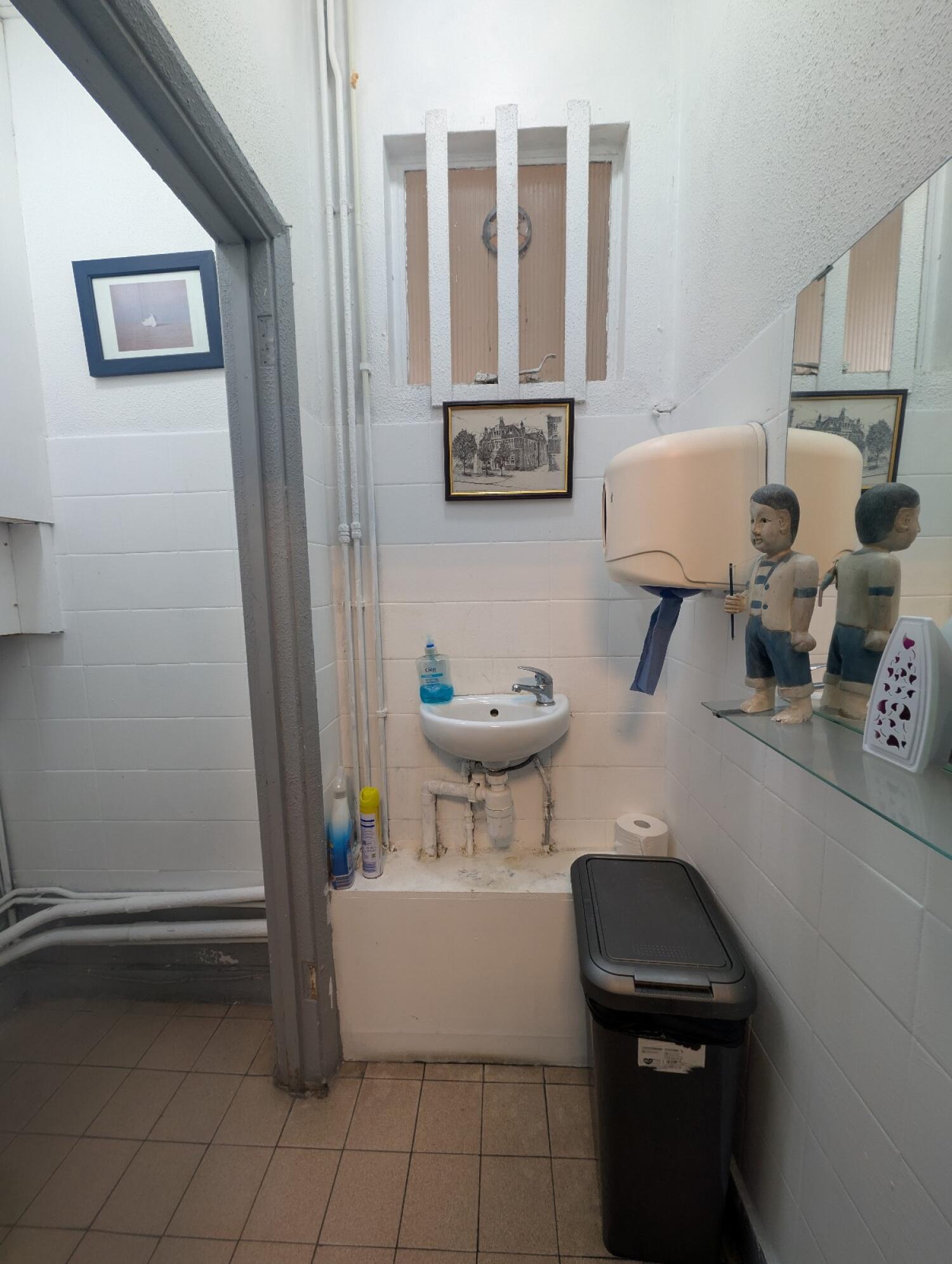 From bathroom door facing straight. Sink at back.