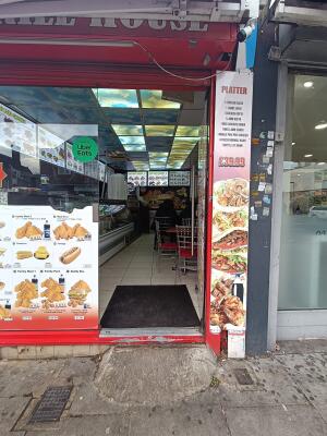 Glass door ahead. Push to open via metal handle on left.