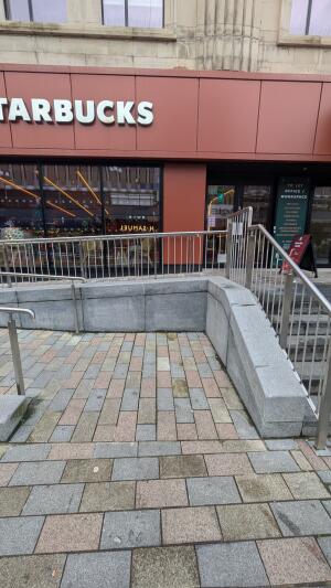 From street facing venue. Path ahead. Ramp up on left.