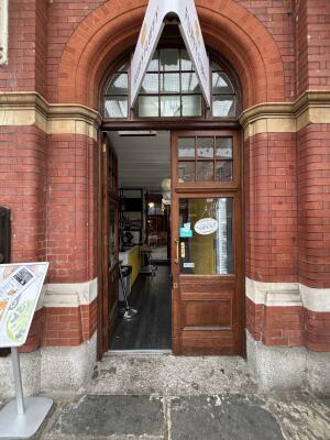 Wood-framed glass doors. Push from handles in centre un to open.