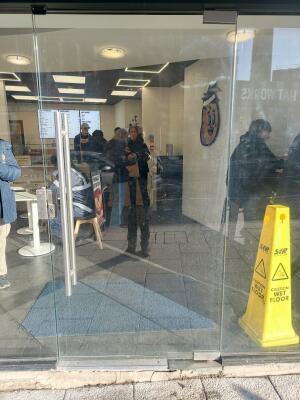 Glass door ahead. Push from handle on left to open.