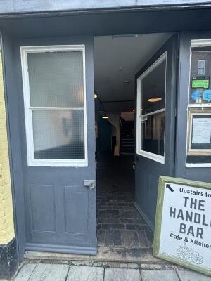 Blue wooden glass doors ahead. Push from centre to open.