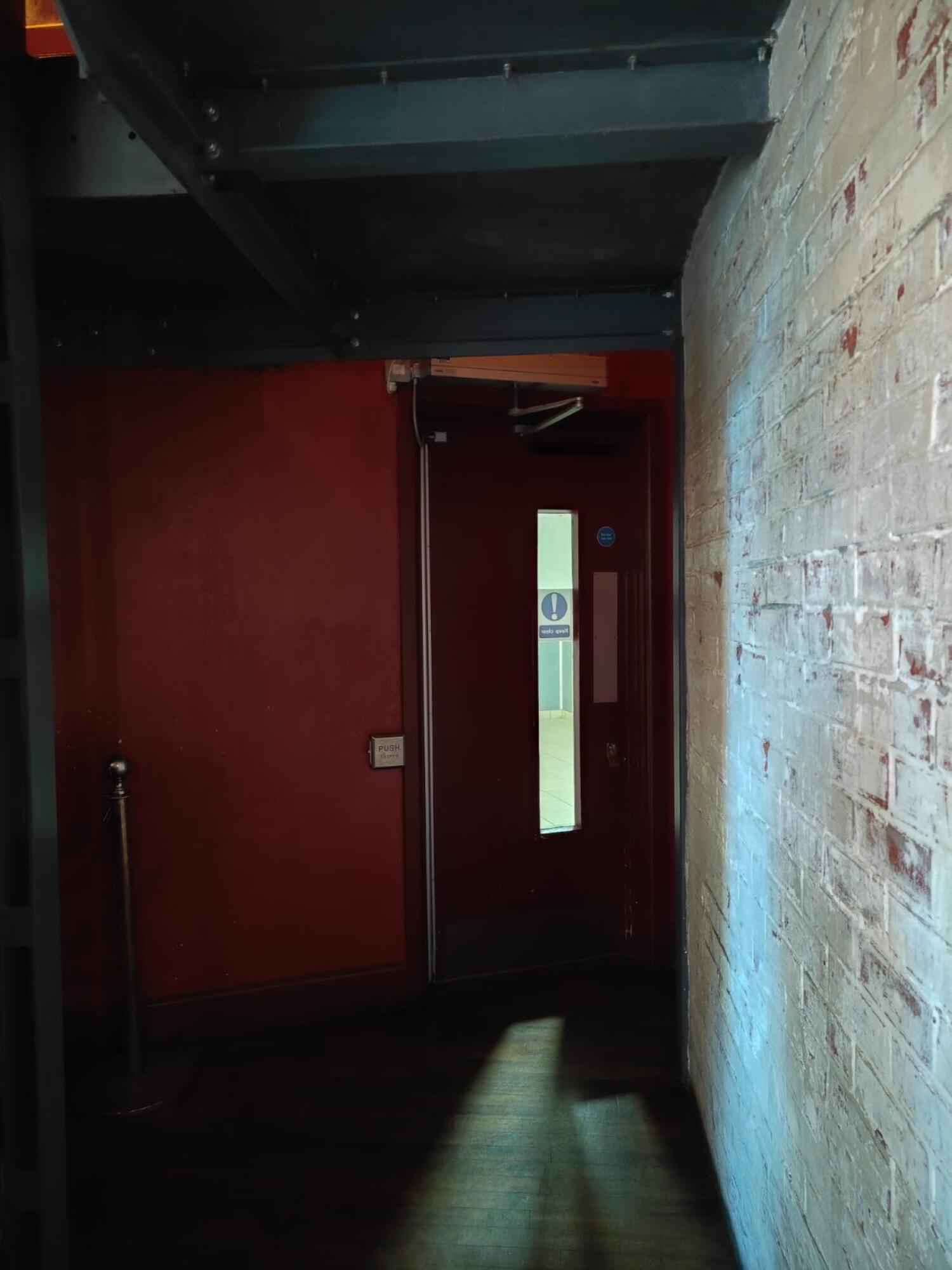 From opening facing left. Path ahead to door at back.
