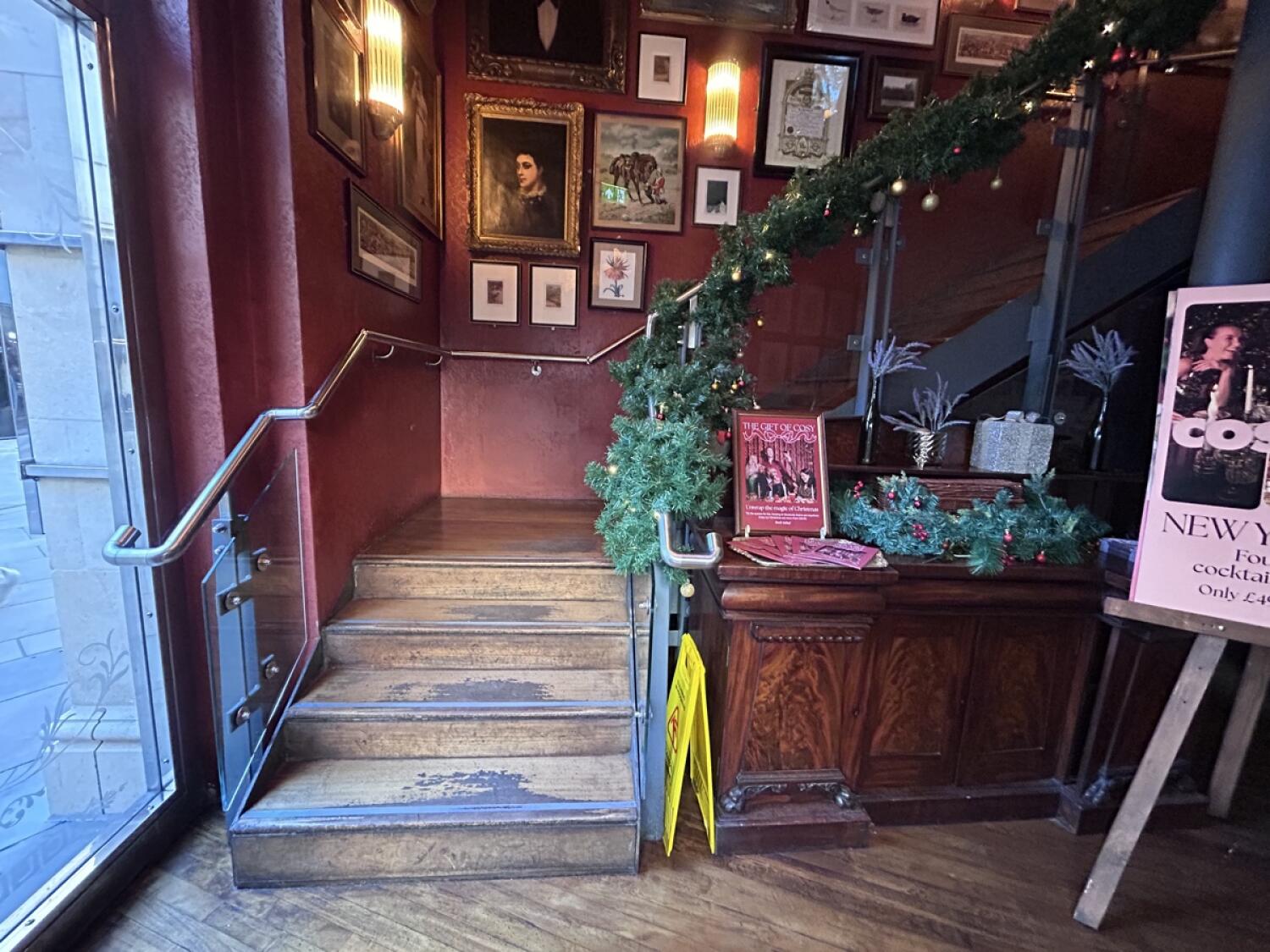 From door facing left. Stairs going up.