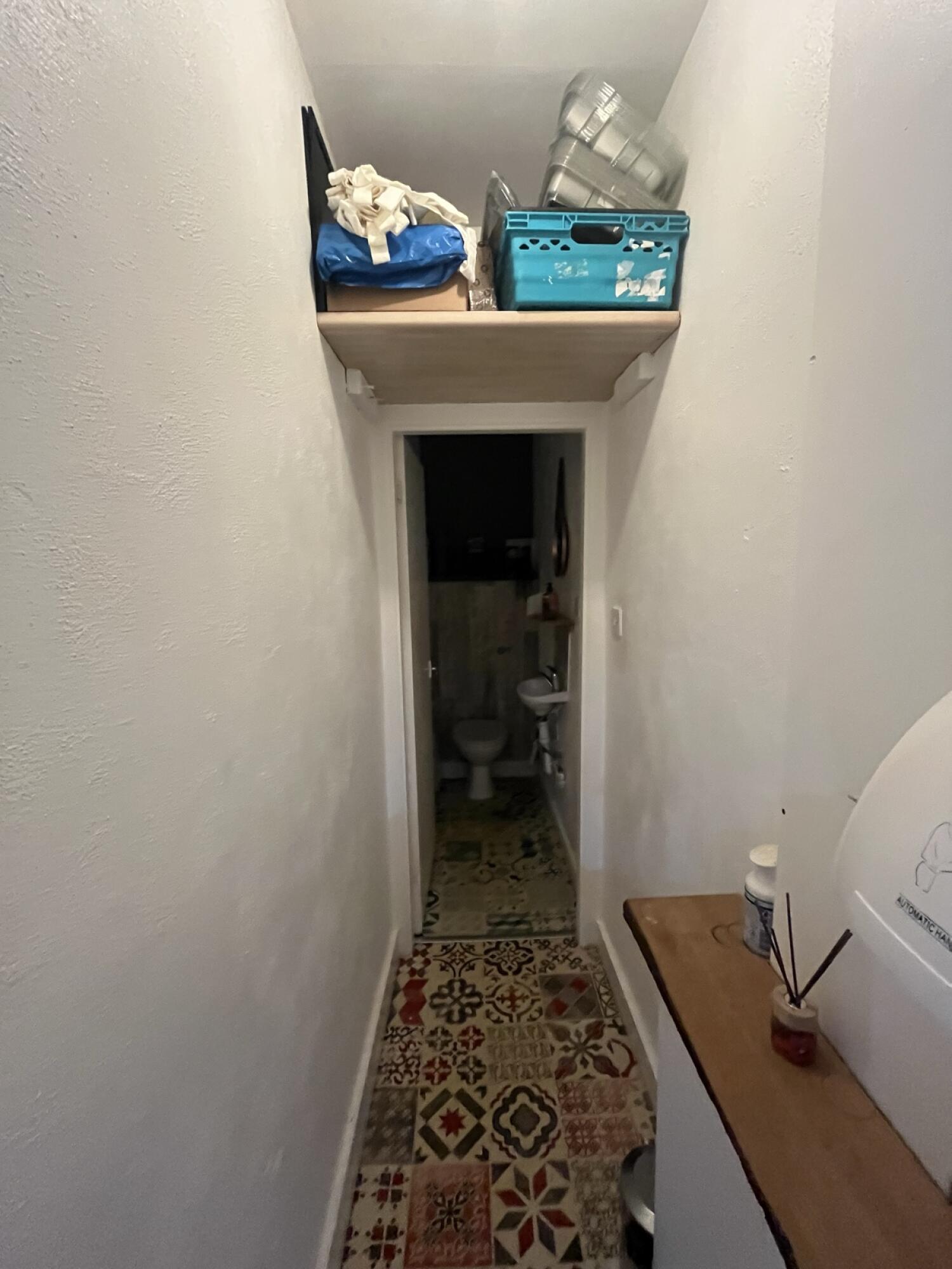 From door facing straight. Open corridor ahead. Door at back.
