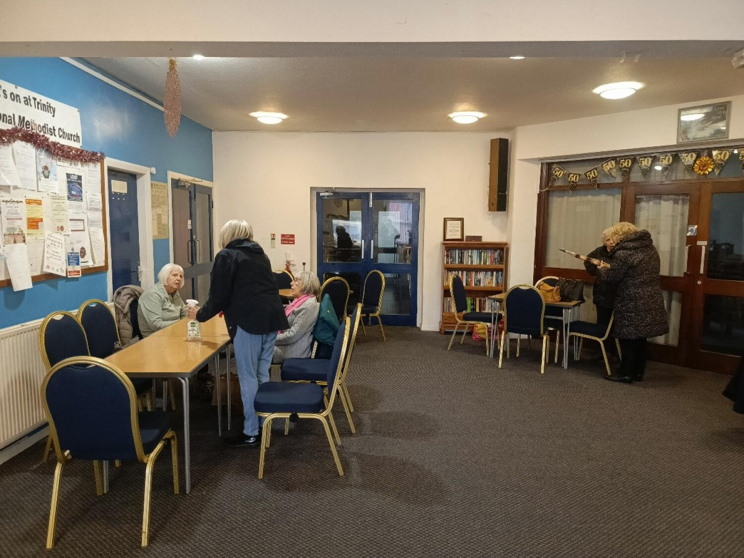 From entrance facing right. Tables and chairs along left and back right.
