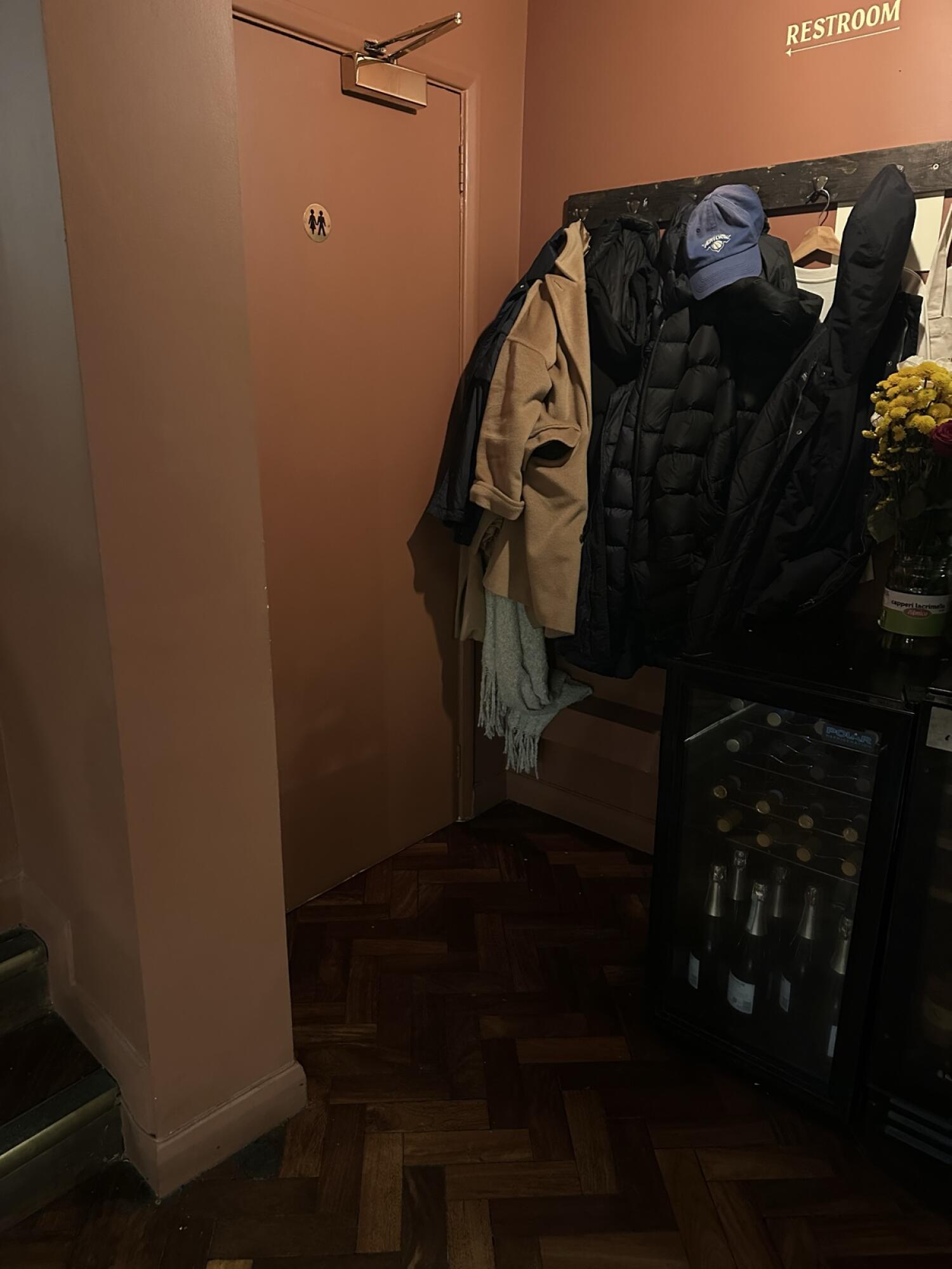 Brown door ahead. Pull from handle on left to open.
