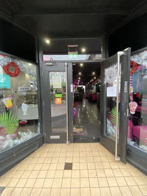 Black framed glass door. Pull silver metal long handle from centre to open.