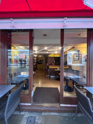 Brown framed glass door ahead. Push from right to open.