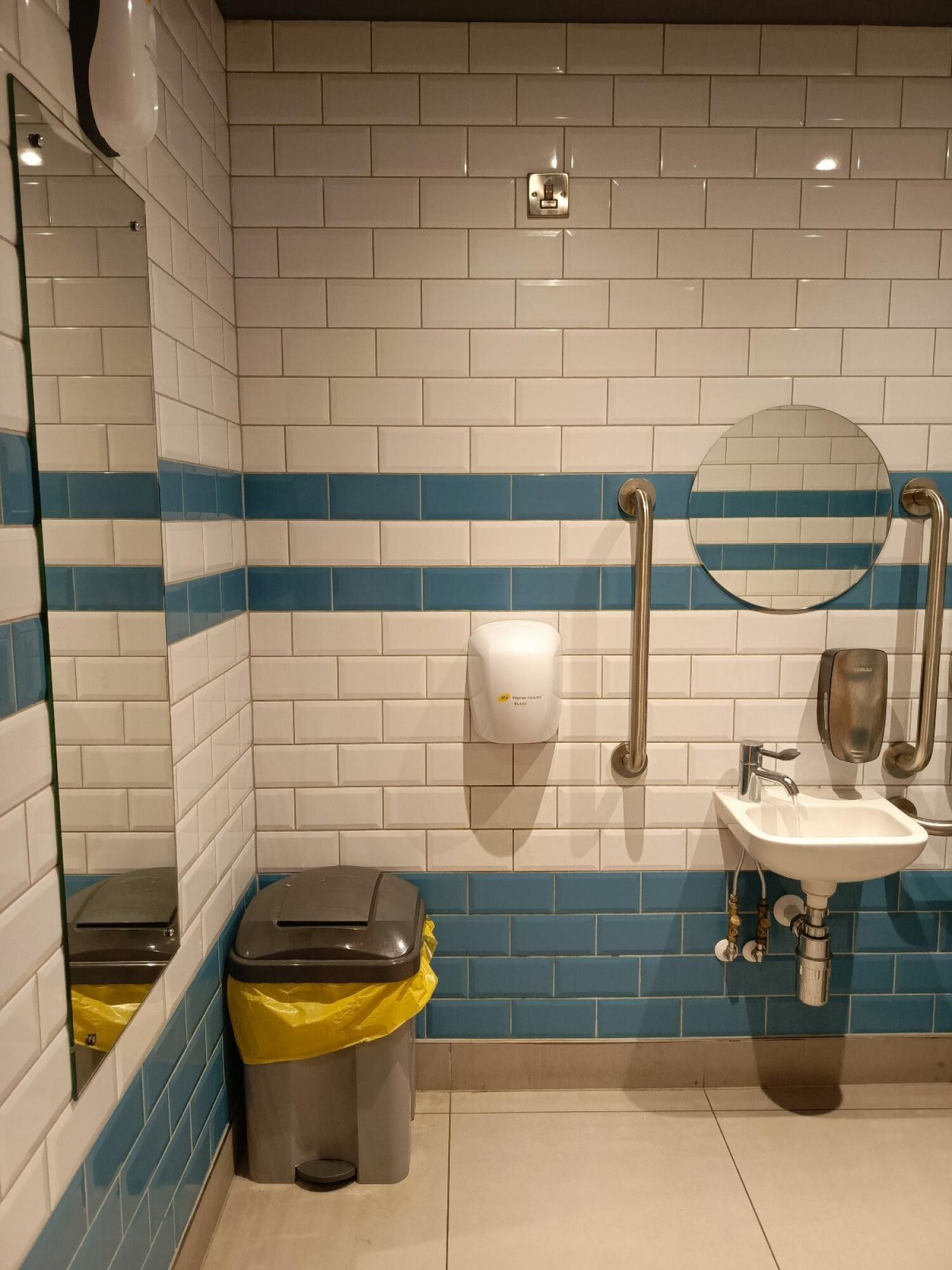 From door facing straight. Sink on right back.