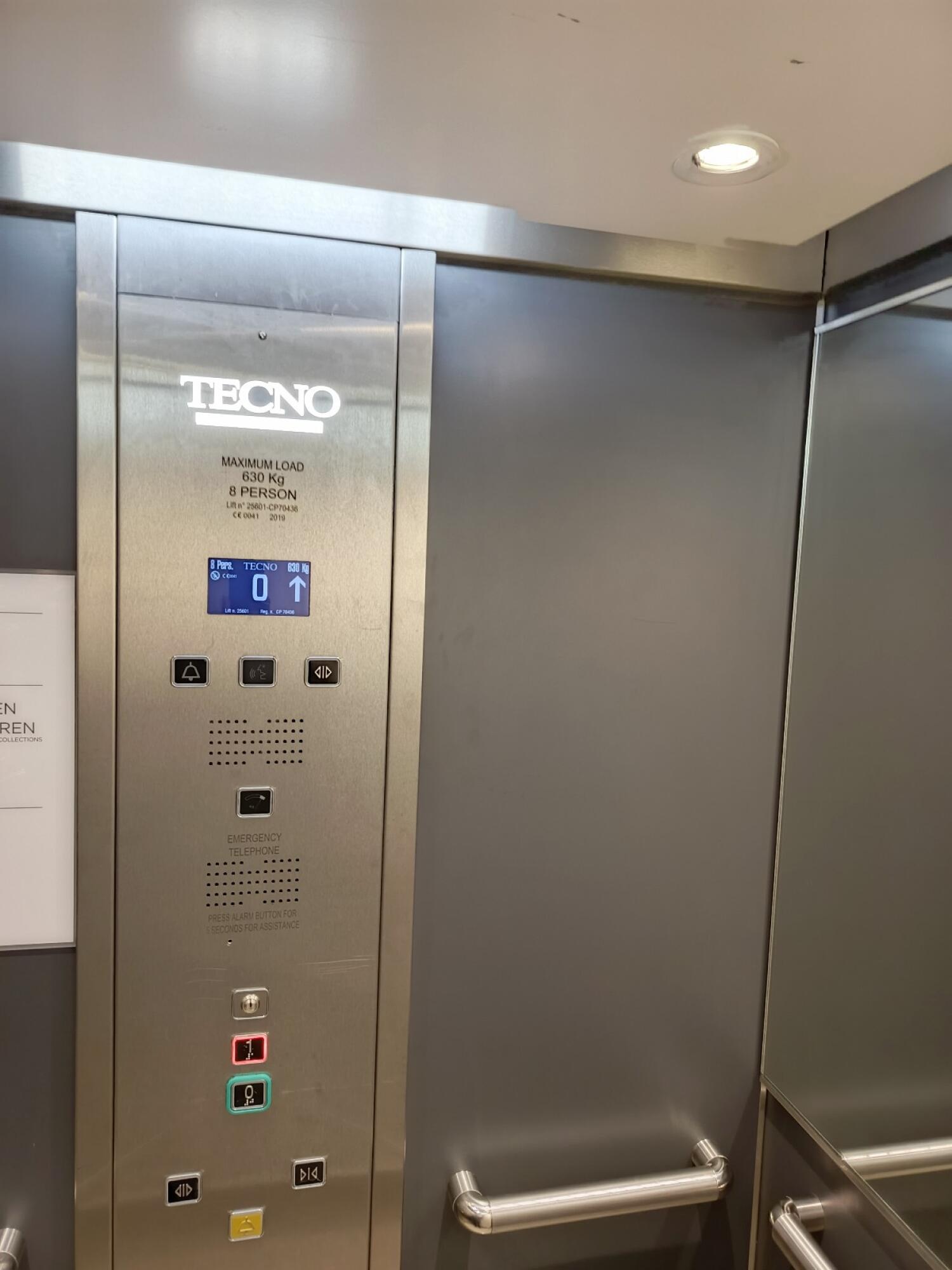 From door facing right. Operation buttons and grab railsat centre.
