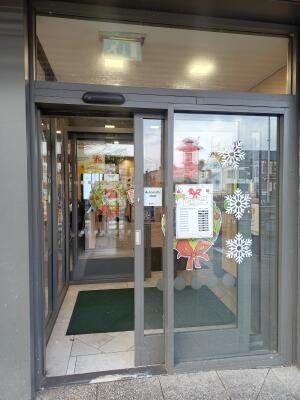 Glass door with grey frame ahead.