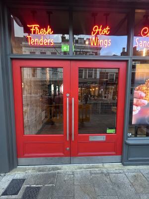 Red wood-framed glass doors. Pull right door from left to open.