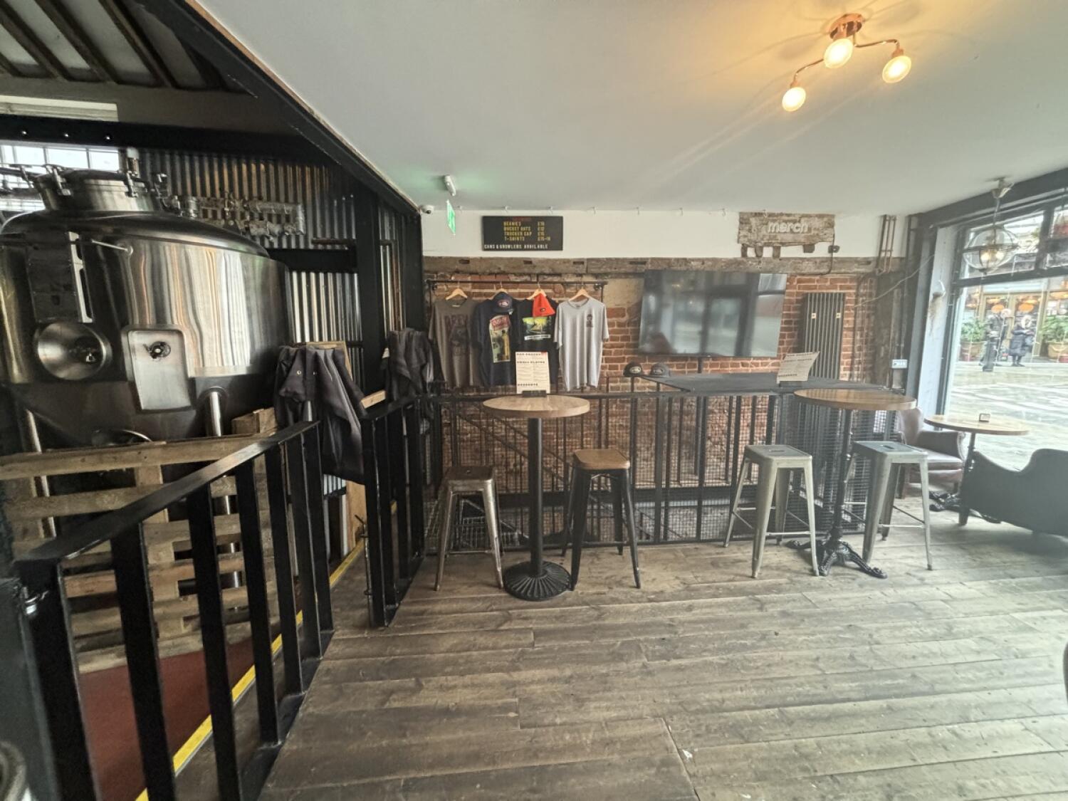 From top of step facing straight. High tables and stools at back.