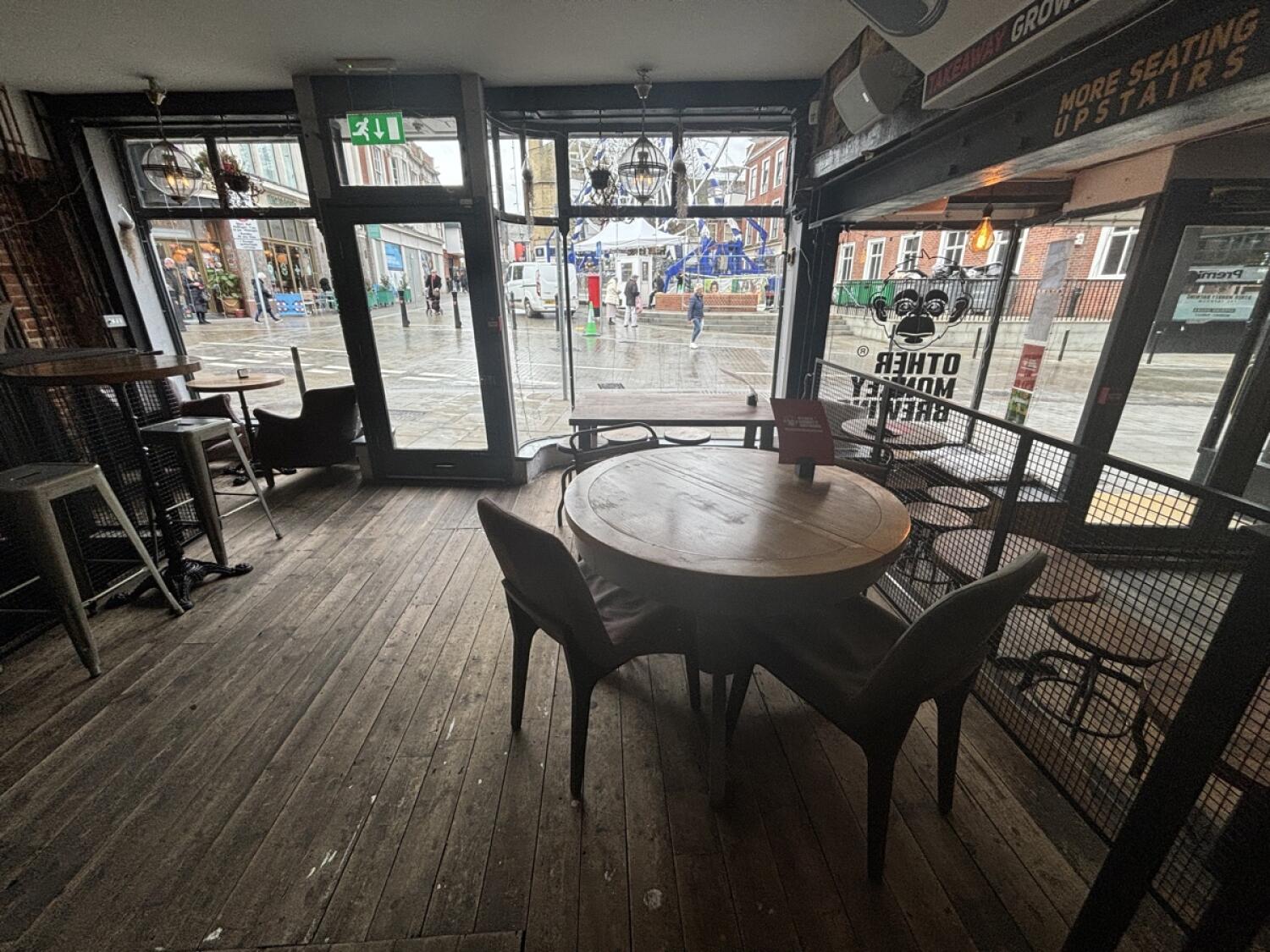 From top of step facing right. Table and chairs ahead. Table and stools behind.