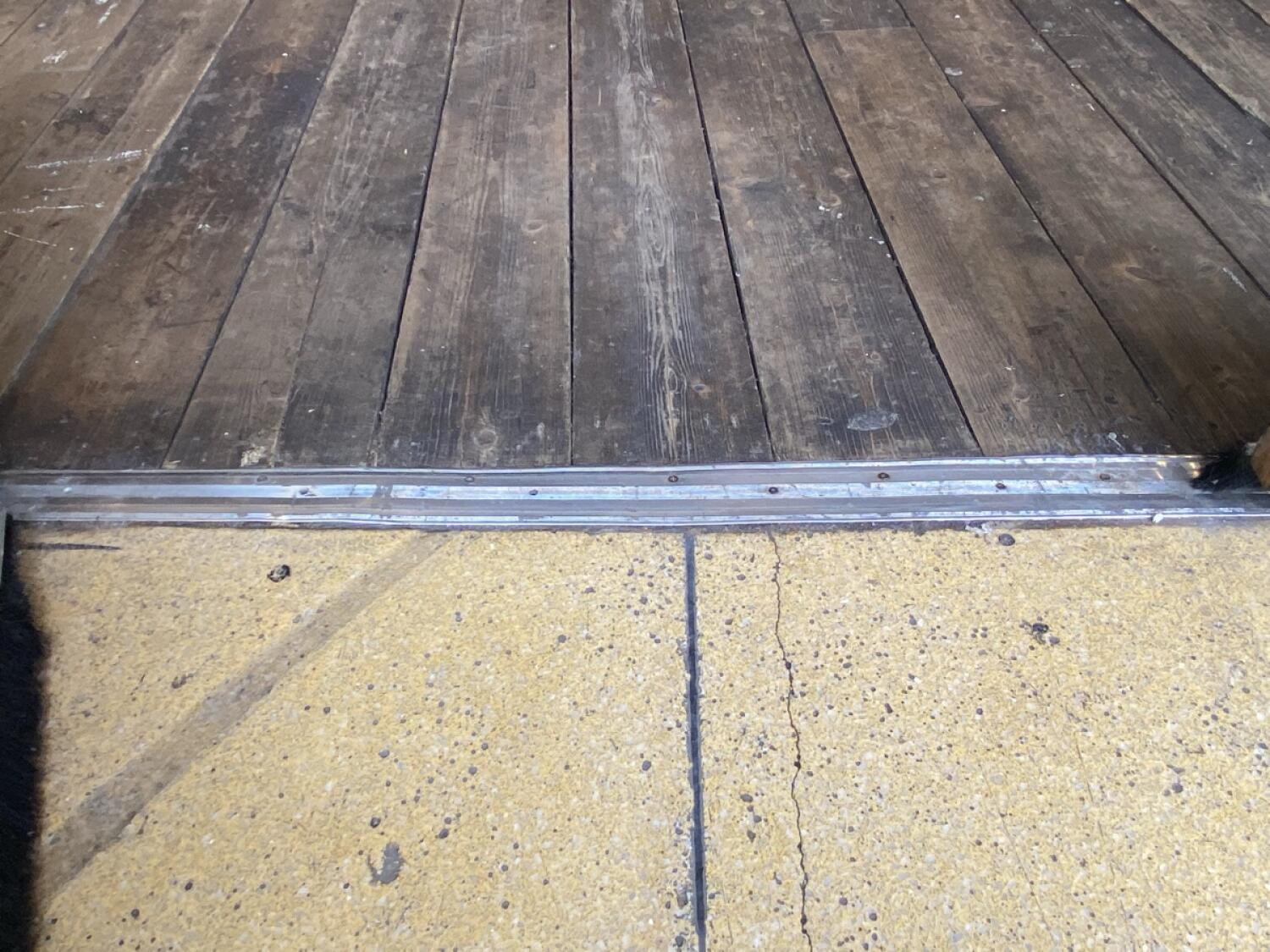 Small metal bump at door foot.