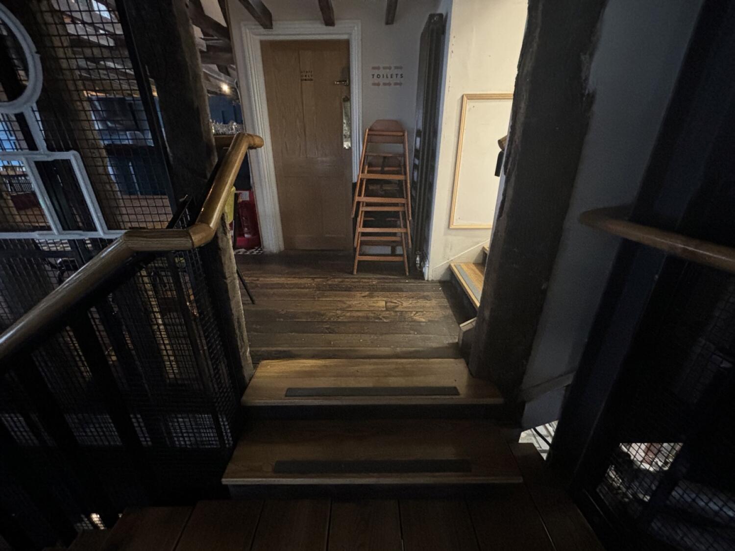 From first landing facing left. Two steps up more to access area. Handrail on left.
