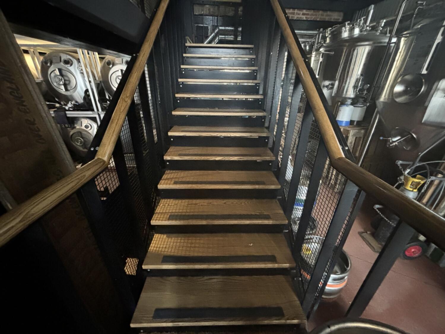 From end of path facing straight. Staircase ahead. Handrails on both sides.