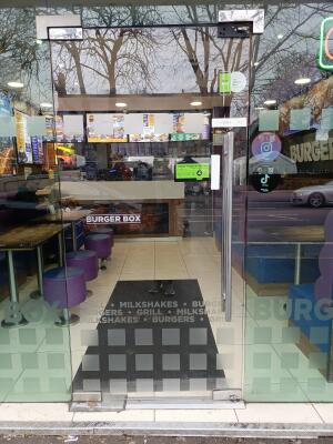 Glass door ahead. Push from handle on right to open.