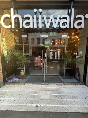 Glass doors ahead. Pull handles from centre to open.