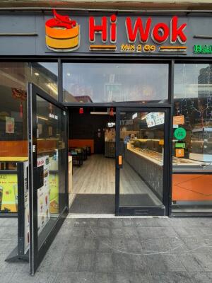 Black framed glass doors ahead. Pull handles in centre to open.