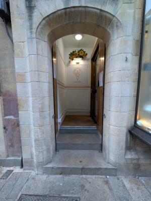 Stone archway in front.