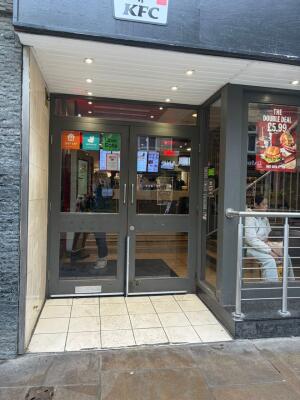 Grey framed glass doors ahead. Pull handles in centre to open.