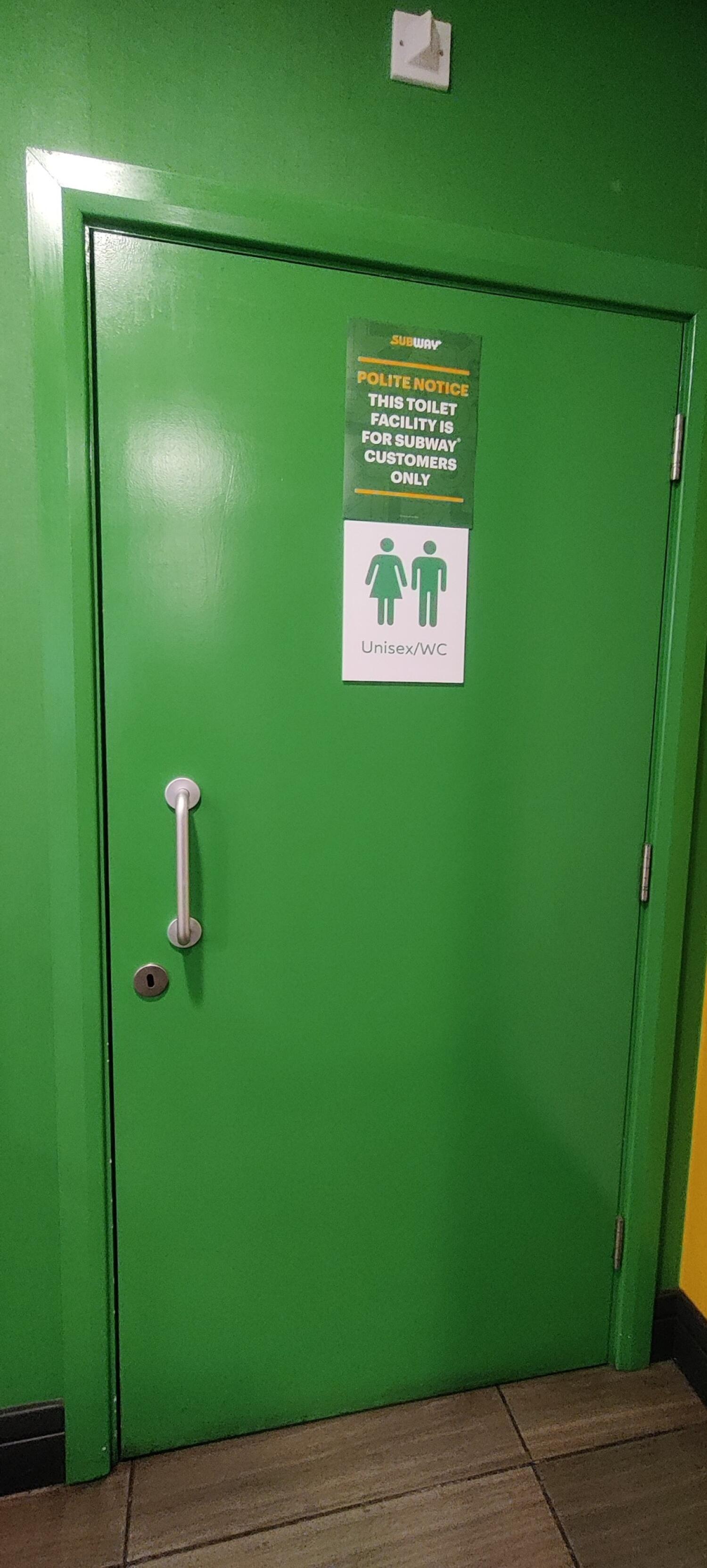 From first door facing straight. Green metal door ahead. Pull metal handle at left.