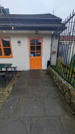 From right of venue facing right. Slope up to door.