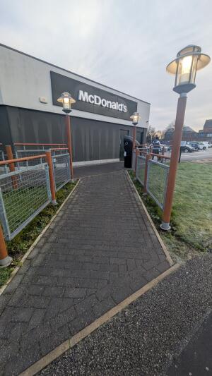 From street facing venue. Pathway ahead leading to entrance door.