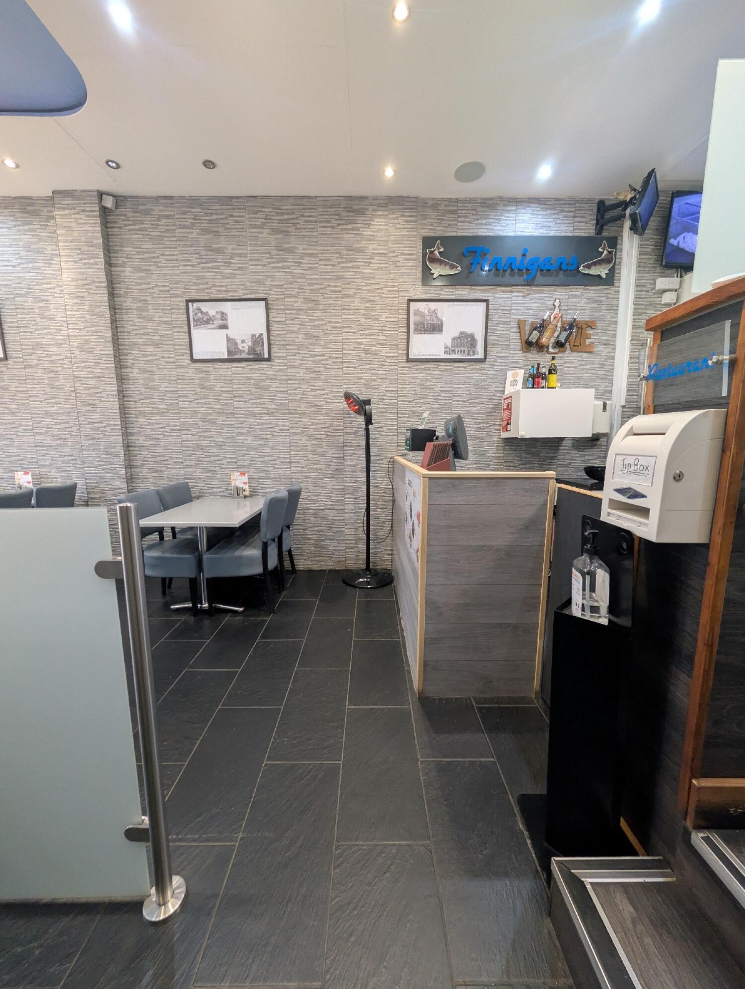 From end of divider facing left. Opening in front. Staff counter along right.