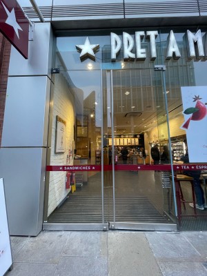Glass doors ahead. Push silver metal handles in centre to open.