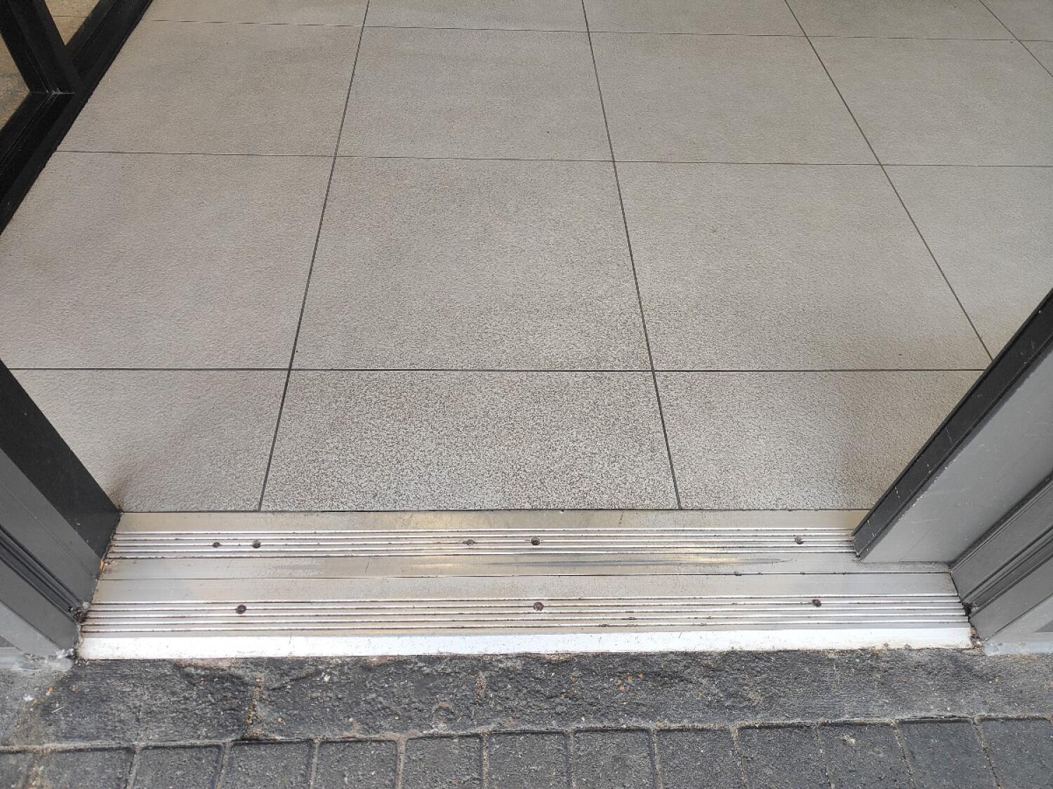 Metal bump at door threshold.