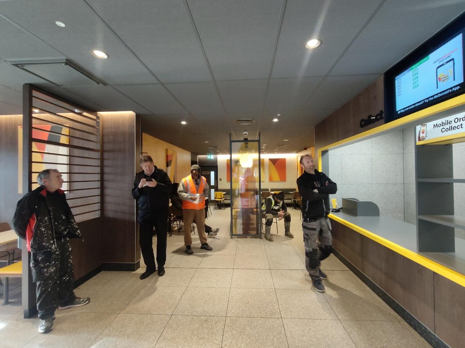 From end of kiosks facing straight. Counter on right.