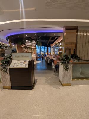 Opening in front. Step free access. Welcome desk on left front.