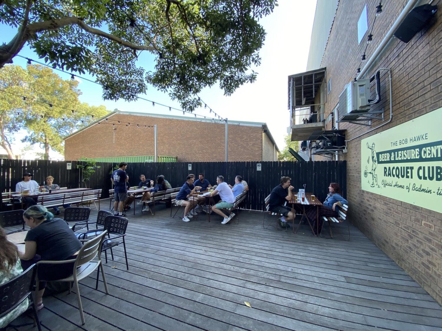 From door facing right. Long tables and benches along back wall.