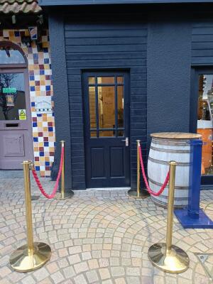 From street facing venue. Dividers on left and right. Path to door at centre.