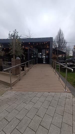 Ramp up to venue. Hand rail on both sides.