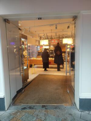 Double glass doors ahead. Push from metal handles at centre to open.