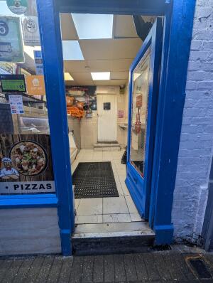 Blue-framed glass door. Push door from left to open.
