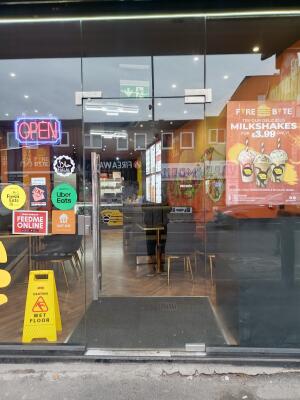 Glass door ahead. Push from metal handle on left to open.