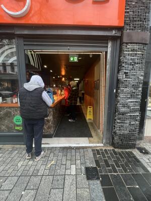Open archway ahead. Small bump at foot of door.