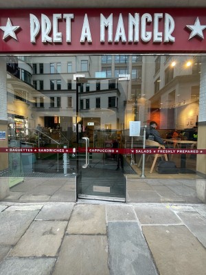 Glass door. Push silver handle on left to open.