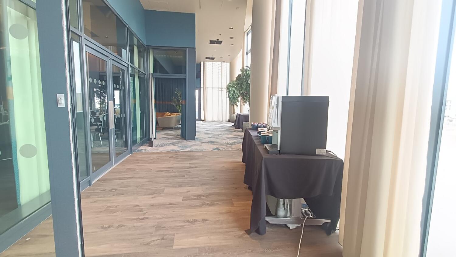 From door facing left. Alternative door on back left. Path to side space in centre. Table on right.
