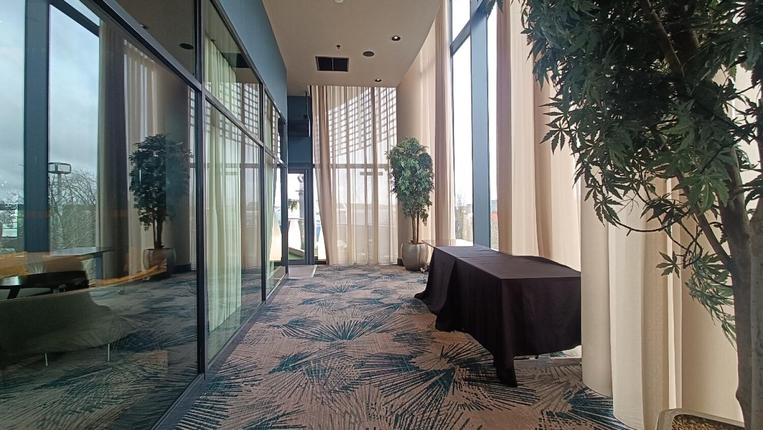 From right of alternative door facing straight. Path to side space in centre. Table along right wall.