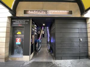 Open archway ahead from Pitt street Sephora entrance. Escalator inside leading up.
