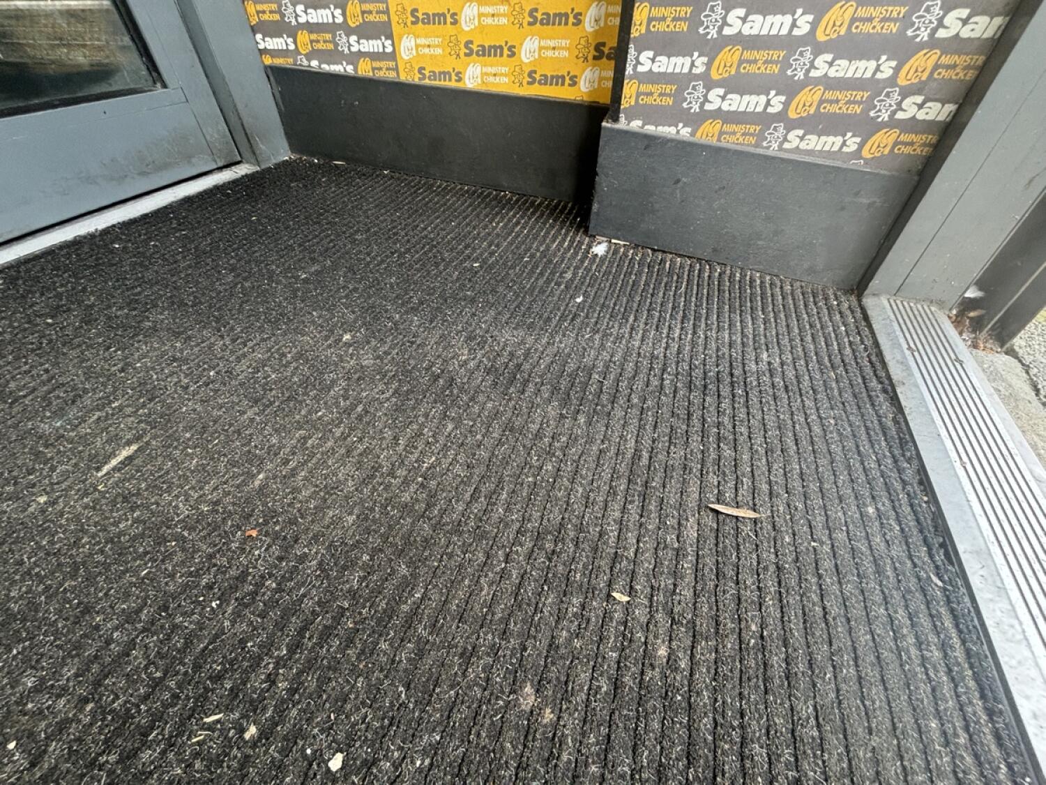 Inbuilt ramp slopes up from foot of archway to entrance door.