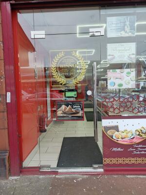 Glass door ahead. Push from metal handle on right to open.