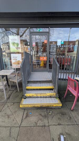 From street facing venue. Four steps up before door.